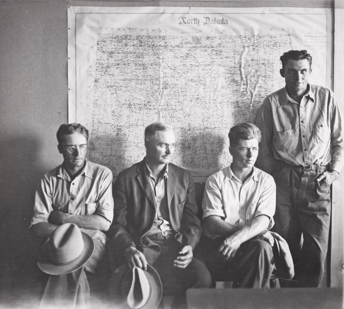 ARTHUR ROTHSTEIN (1915-1985) North Dakota farmers waiting for their grants in Resettlement Administration office, North Dakota * Migran